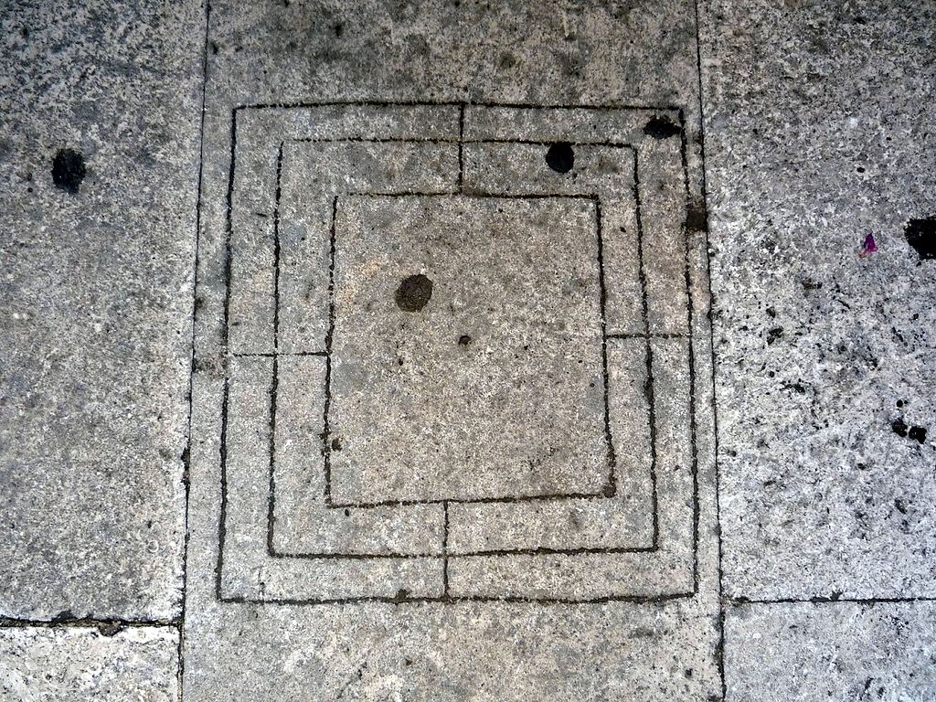 Nine Men's Morris board carved into the stone floor by Diocletian's Mausoleum in Split, Croatia